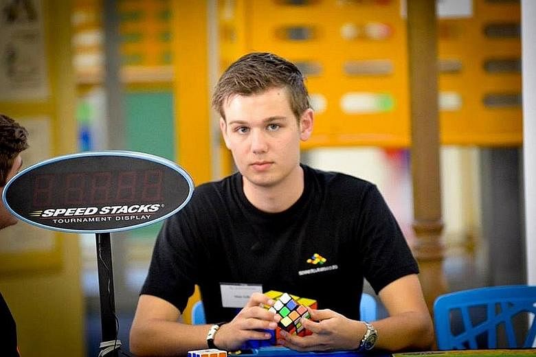 Dutch student Mats Valk has set a new world record to solve a 3x3 Rubik's Cube - 4.74 seconds. Seen here in a 2014 photo, he is now on exchange at Nanyang Technological University until next month.