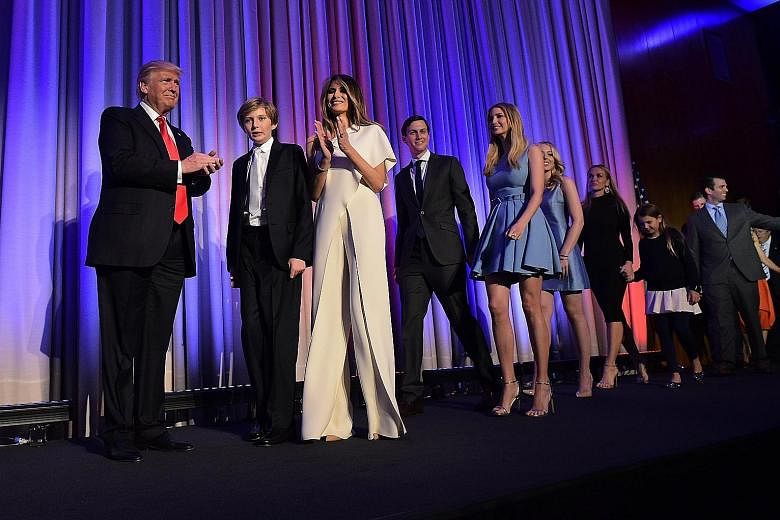 On election night, Mr Donald Trump wore his usual dark suit and red tie while Mrs Melania Trump wore a white Ralph Lauren jumpsuit, which she had bought off the rack.
