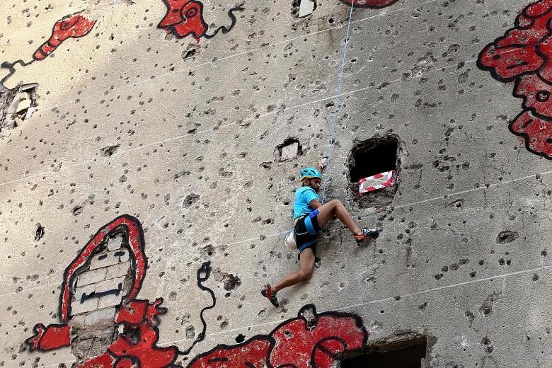 In an effort to transform war-torn buildings into climbing challenges, Beirut's Al-Kamal building became the site of an urban climbing competition on Saturday. The building was severely damaged during the Lebanese civil war from 1975 to 1990, with it