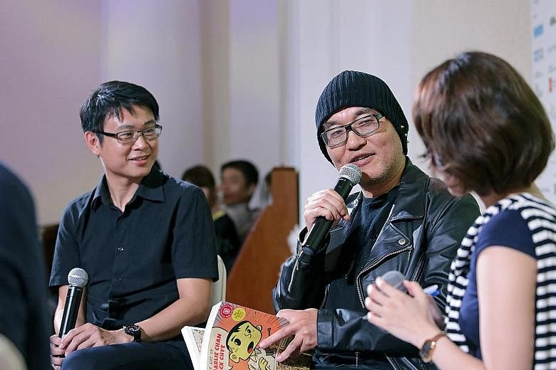 Gosho Aoyama (centre) with Singapore artist Sonny Liew at the talk on Sunday.