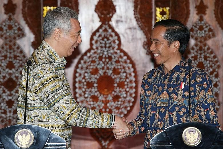 PM Lee with President Joko at a joint press conference at Wisma Perdamaian in Semarang, Indonesia, yesterday. At their meeting, the two leaders reaffirmed their commitment to strengthening ties and to further economic cooperation between their countr