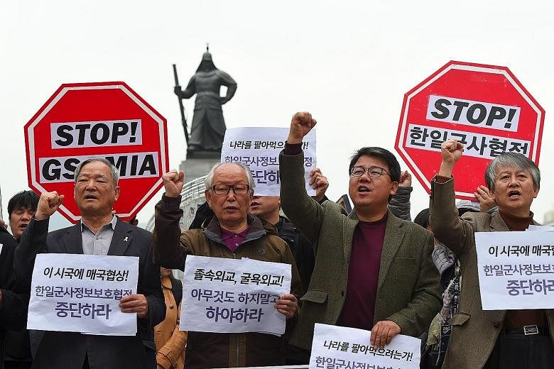 Demonstrators in Seoul yesterday protesting against an intelligence-sharing pact between South Korea and Japan. Memories of Tokyo's colonial rule and wartime actions still rankle in South Korea.