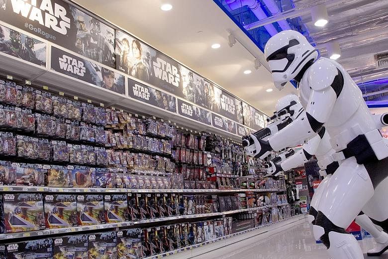 Sales of action figures, such as these in a Toys 'R' Us store at VivoCity, are expected to get a boost from upcoming movie releases such as Rogue One: A Star Wars Story.