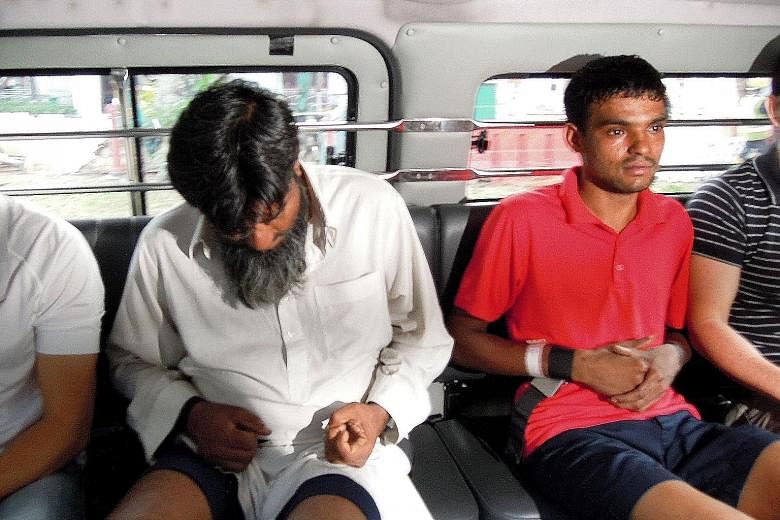 Rasheed Muhammad (left) and Ramzan Rizwan are accused of killing Mr Muhammad Noor, allegedly to recover money both men lost to the victim in a game of cards.