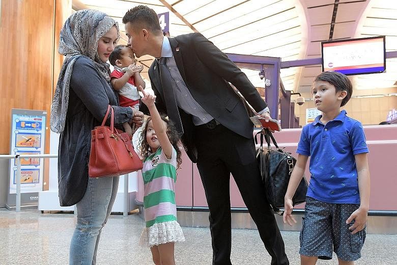 Defender Baihakki Khaizan bidding his family farewell at Changi Airport before flying to the Philippines for the AFF Suzuki Cup with the Lions. A veteran with three titles, he has called on his younger team-mates to give everything for the competitio