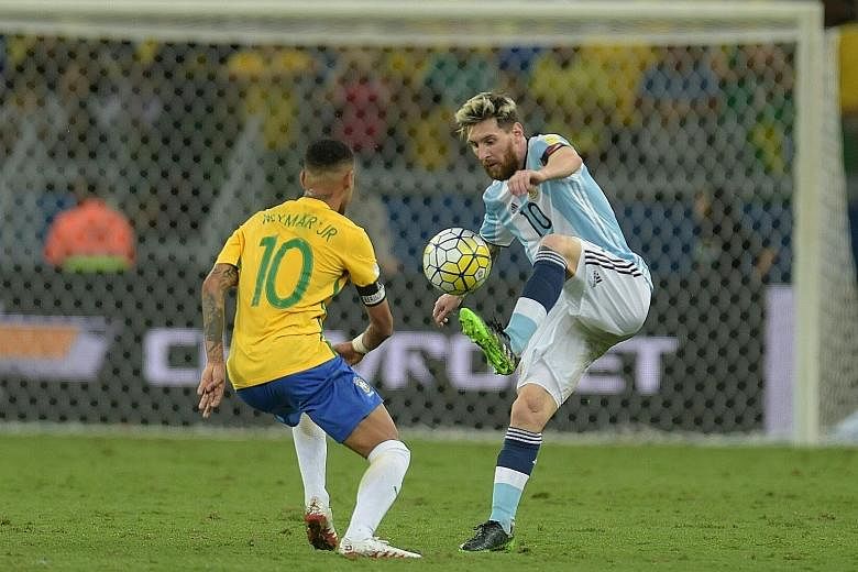 Argentinian star Lionel Messi trying to get past Brazil's Neymar, his Barcelona club mate, during their World Cup qualifier in Belo Horizonte last Thursday. Brazil won 3-0 to heap more pressure on their South American rivals, and anything less than a