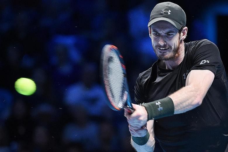 Freshly-minted world No. 1 Andy Murray hitting a return during his 6-3, 6-2 straight-sets win over Marin Cilic of Croatia at the ATP World Tour Finals.