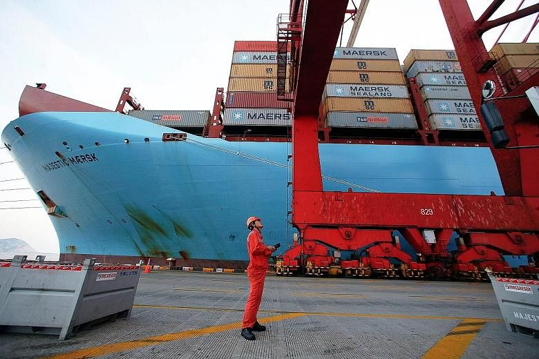 A worker at the Yangshan Deep Water Port in Shanghai, China. Analysts say that a trade war between China and the US will hurt not only the nations' ties but also regional economies.