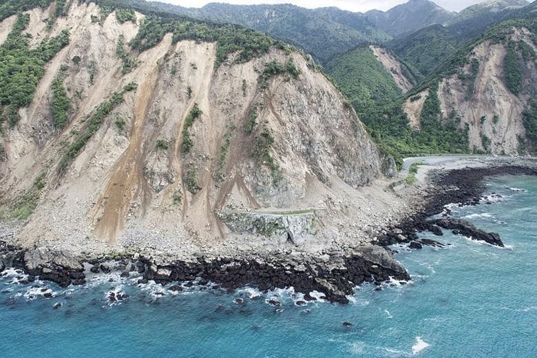 Landslides block transport links along the coast, as shown in an aerial picture from the Royal New Zealand Air Force.