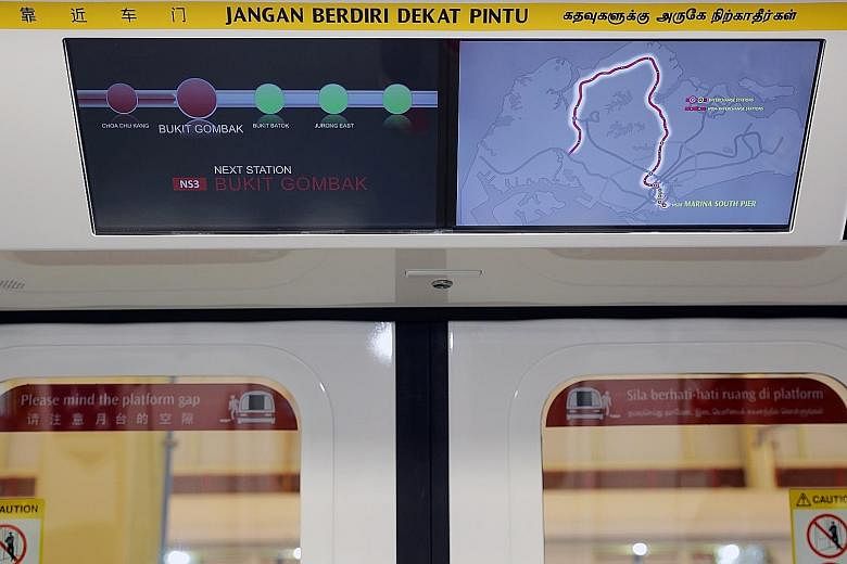 Top: The 19 six-car trains will have new cabin lighting and doors. Below: There will also be a new, graphical route map information system on board.
