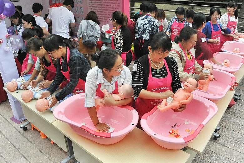 Confinement nannies displaying their skills at the annual home economics expo held in Shanghai last month.