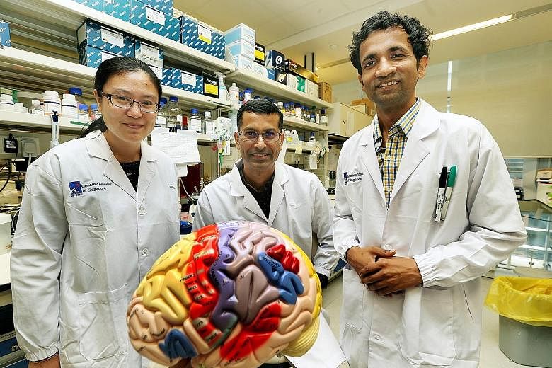 Dr Prabhakar (centre) with members of his team, research associate Sun Wenjie (left) and research scientist Vibhor Kumar. In the team, almost everyone knows someone with autism.