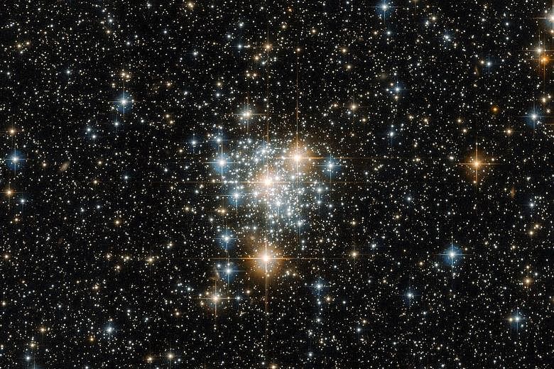 This is an image of NGC 299, an open star cluster located within the Small Magellanic Cloud, just under 200,000 light years away. According to the European Space Agency, an open cluster such as this is a collection of stars weakly bound by the shackl
