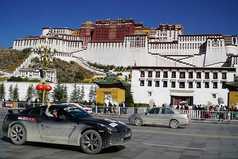 At the Everest Base Camp (top), which has a view of Mount Everest; and driving along a flooded road (above). Mr Hoong Kah Chuan at Lhasa's Potala Palace (above), and the 108 bends (left) he drove through to get to the base camp.