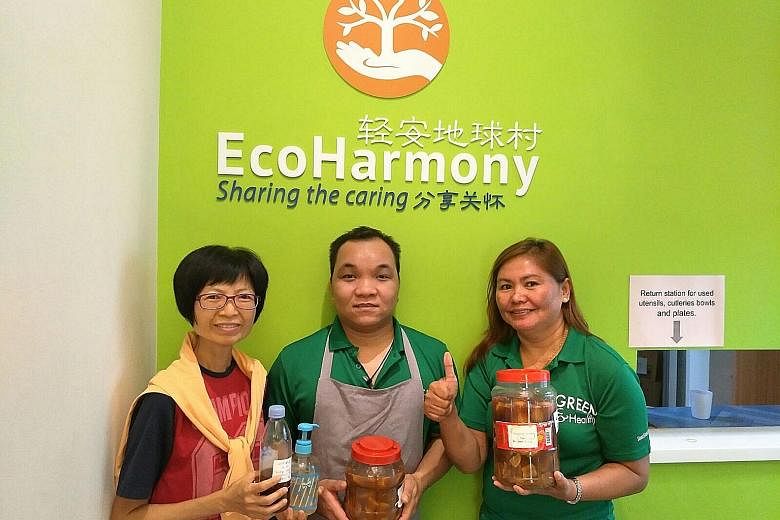Volunteer Ng Wai Sen (left) with her homemade garbage enzymes she uses for cleaning purposes. At Eco-harmony cafe (right), which is part of charity and education foundation Kampung Senang, its staff uses garbage enzymes to wash dishes.