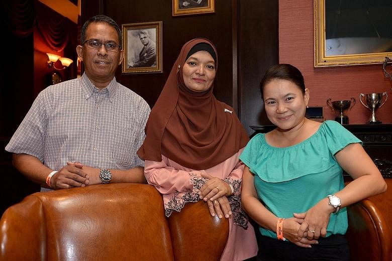 Retiree Azman Asmat and his wife Maimunah Dolah have cared for three foster children since 2008. Next to them is adjunct polytechnic lecturer Stacey Low, who took in a pair of two-year-old twins in July.