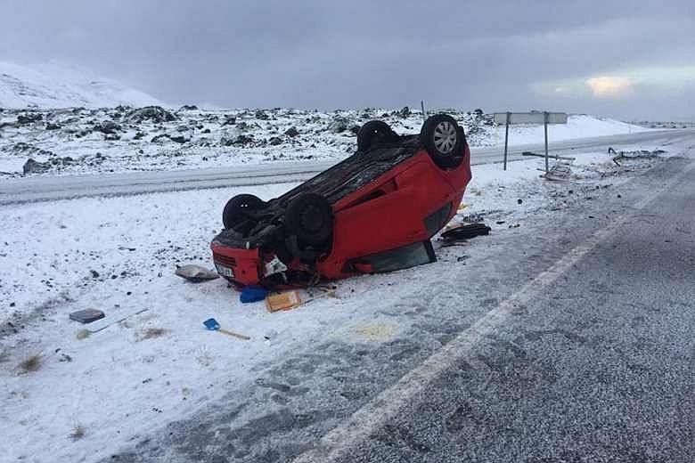 The red Toyota which overturned on an icy road in Iceland on Tuesday and left the driver, Ms Audur Gisladottir, trapped inside.