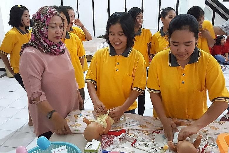 Domestic workers being trained in Jakarta. From next February, workers will also have to learn the language and culture of the country they will be going to.