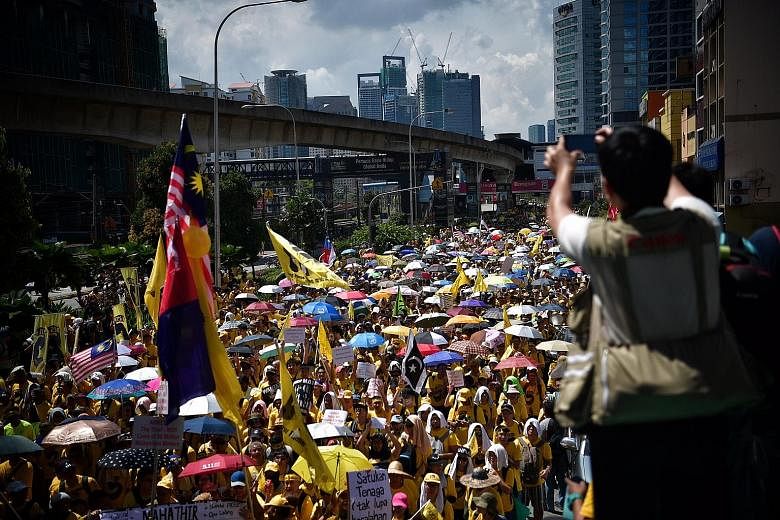 Rivers of yellow flowed in downtown Kuala Lumpur yesterday as protesters demanding the resignation of Malaysian Prime Minister Najib Razak over a corruption scandal blew vuvuzelas and chanted "Hidup rakyat" (Long live the people). Leading reformist g