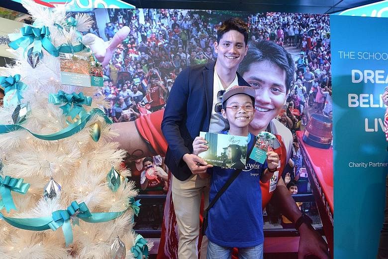 Bryan Liu, 11, along with four other children with life-threatening illnesses from Make-A-Wish Foundation Singapore, had his wish granted when he met Joseph Schooling yesterday at the launch of the Watsons Dream Tree Initiative. It was the University