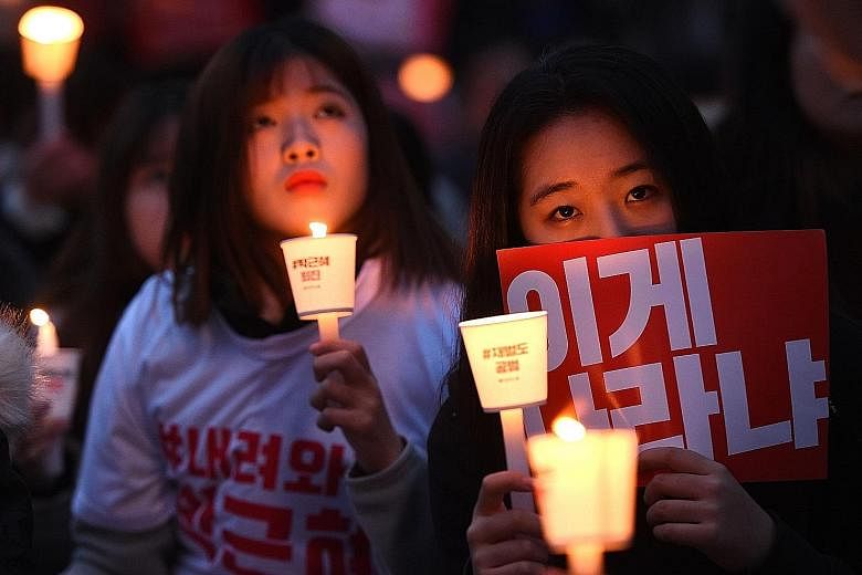 Hundreds of thousands of South Koreans took to the streets of Seoul (left) and other regional capitals last night in the fourth straight weekend of protest against embattled President Park.