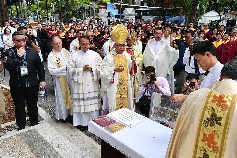 Archbishop Goh yesterday placed a time capsule and commemorative stone to mark the success of the restoration of the Cathedral of the Good Shepherd.