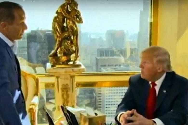 United States President-elect Donald Trump chatting to TMZ founder Harvey Levin in Trump Tower.