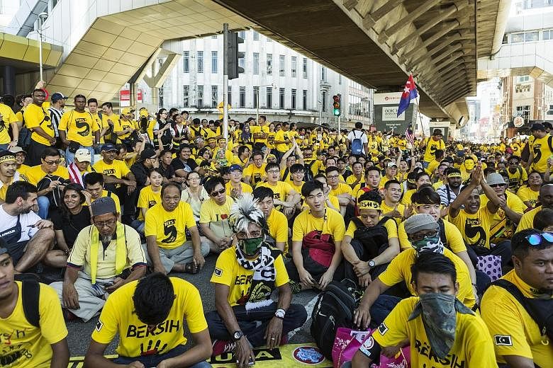 Protesters dressed in yellow gathering near Merdeka Square on Saturday. KL police said 15,500 people turned up although local media reports put the figure at more than double that. The Red Shirts were said to have drawn only 2,500 supporters.