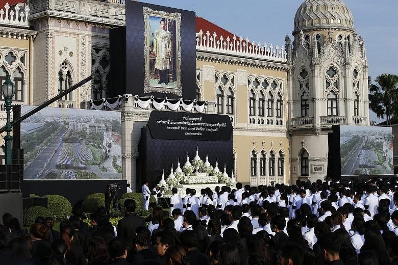 Junta leader Prayut Chan-o-cha, who seized power in 2014, led 3,000 civil servants yesterday during a ceremony in Bangkok in front of a giant portrait of the king.