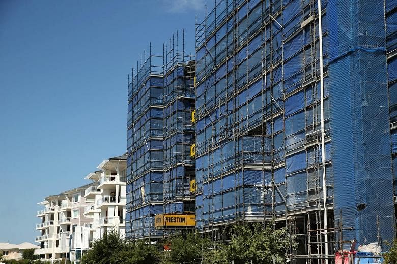 Apartment blocks under construction in a Sydney suburb. Economist Shane Oliver from AMP Capital expects apartment prices in parts of Sydney and Melbourne to fall by about 15 per cent to 20 per cent over the next two years.