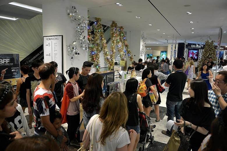 Shoppers at Robinsons The Heeren in Orchard Road on Black Friday in November 2014. The department store and furniture retailer Courts will offer promotions for Black Friday, a shopping frenzy which is a US tradition celebrated on the last Friday of N