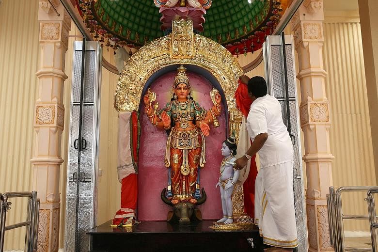 Left: The sculpture of goddess Sri Durga was not moved during the rebuilding process. Far left: The redesigned Sri Siva Durga temple can now host about 500 worshippers.