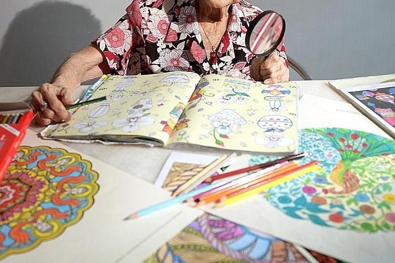 Madam Yeo derives simple joy from colouring intricate mandala designs.