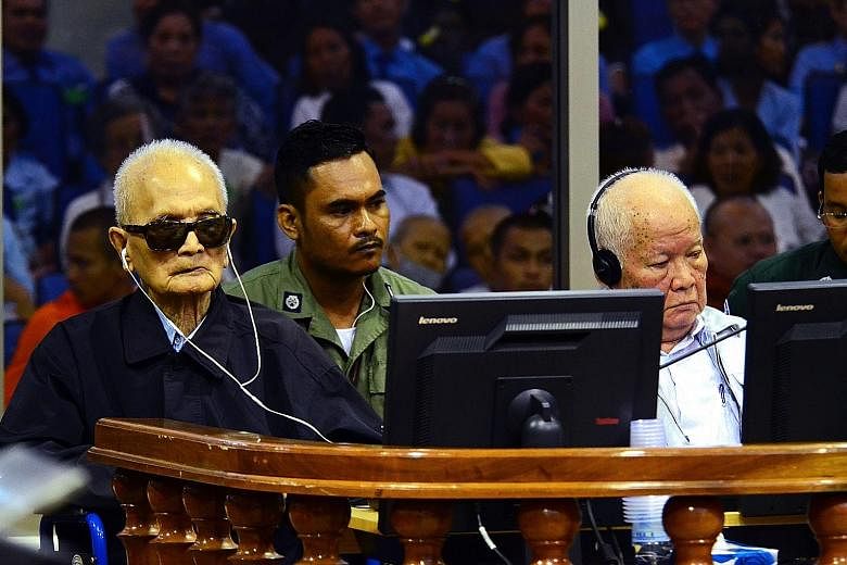 Khmer Rouge leader "Brother No. 2" Nuon Chea (left) and former Khmer Rouge head of state Khieu Samphan (right) at the Extraordinary Chambers in the Courts of Cambodia hearing in Phnom Penh. Their regime was responsible for the deaths of up to two mil