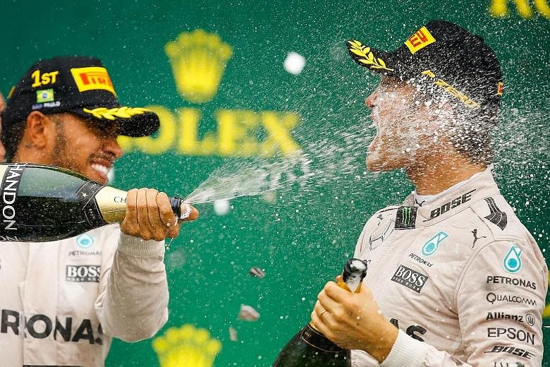 Lewis Hamilton (left) and world title leader Nico Rosberg. The Briton, who has won the world championship three times, will do his best at the Abu Dhabi GP on Sunday to prevent his Mercedes team-mate from joining Michael Schumacher and Sebastian Vett