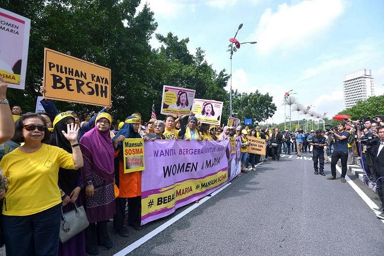 The "Women Walk for Maria" group gathering outside Parliament yesterday to deliver a memorandum to the government demanding the release of Ms Chin.