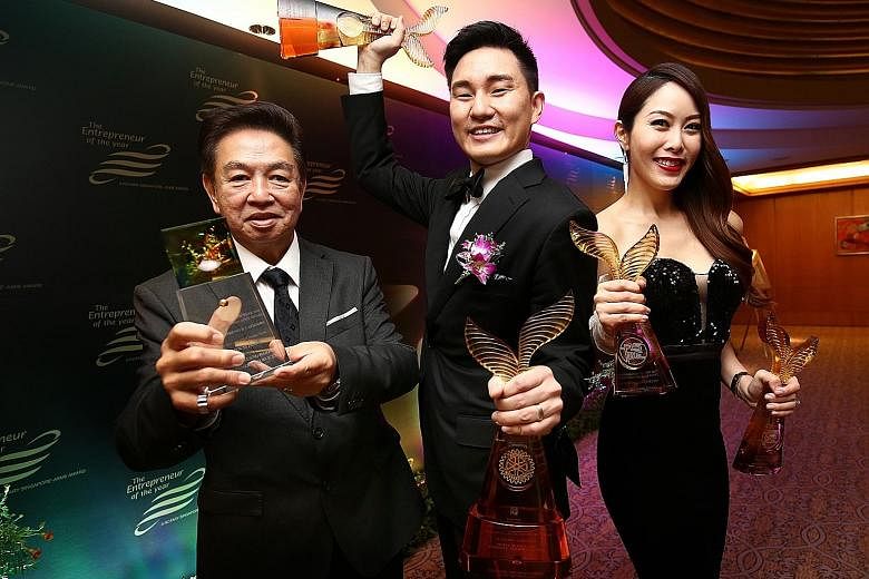 (From far left) Direct Funeral Services founder Roland Tay, executive director Darren Cheng and managing director Jenny Tay. Ms Tay and Mr Cheng were recognised at the Entrepreneur of the Year awards yesterday, taking home honours in the new entrepre