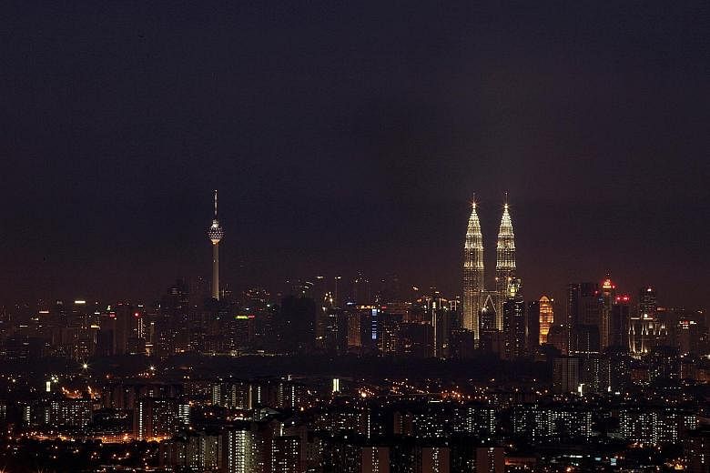 Night falls over the Malaysian capital Kuala Lumpur. Malaysia's economy is forecast to expand at a seven-year low of 4 per cent to 4.5 per cent in 2016.