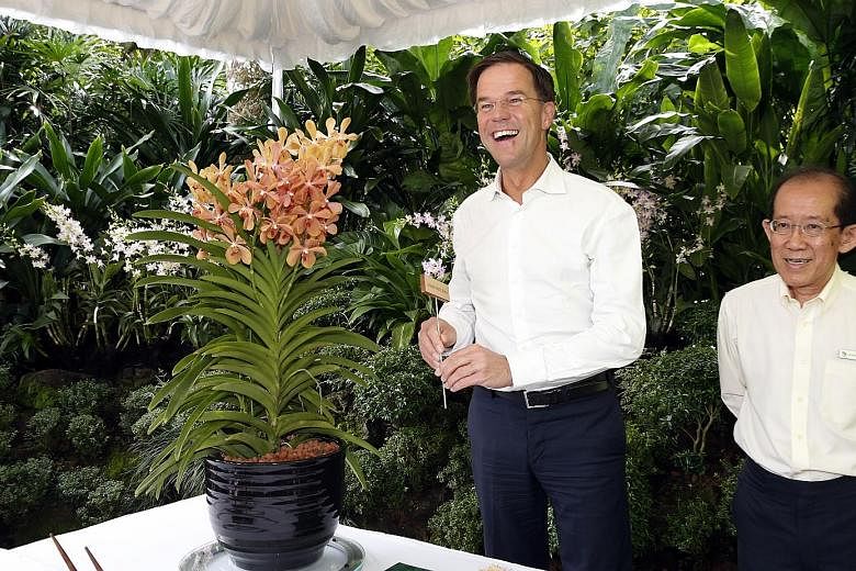 The first stop for Mr Rutte yesterday was the Singapore Botanic Gardens, where an orchid hybrid, Aranda Mark Rutte, was named in his honour. With him is National Parks Board deputy CEO Leong Chee Chiew.