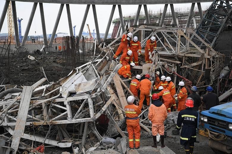 Rescue workers at the scene of the power plant accident yesterday. Industrial accidents are common in China, where enforcement of safety standards is often lax.