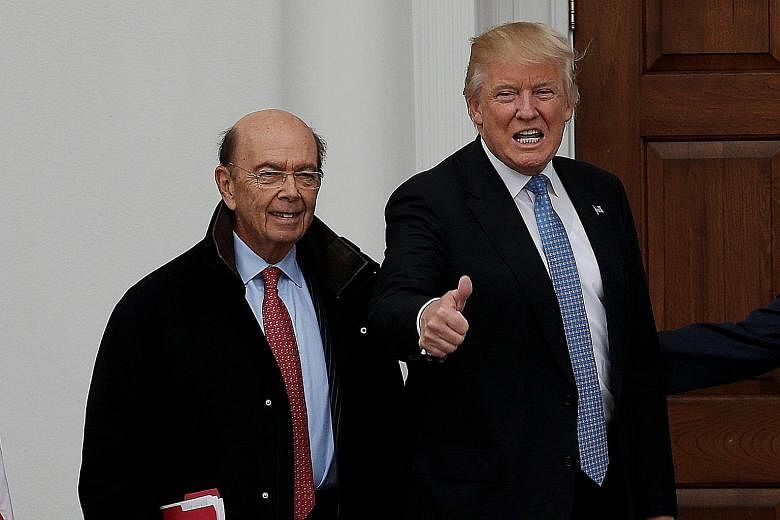 Mr Ross, seen here with the President-elect at the Trump National Golf Club in Bedminster, New Jersey, on Sunday, worked closely on crafting Mr Trump's tax-reduction and infrastructure spending agenda.