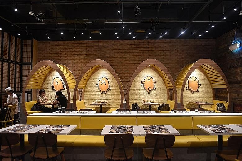 Gudetama Cafe features egg-shaped booths and chairs in the main dining area.