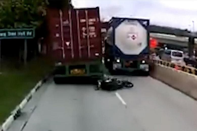Left, from top: A dashboard video of Thursday's accident along Jalan Buroh shows the motorcyclist trying to squeeze through between two trucks, then lying sprawled on the road after being run over. The rider, Malaysian Loh Fook Siong, was pronounced 
