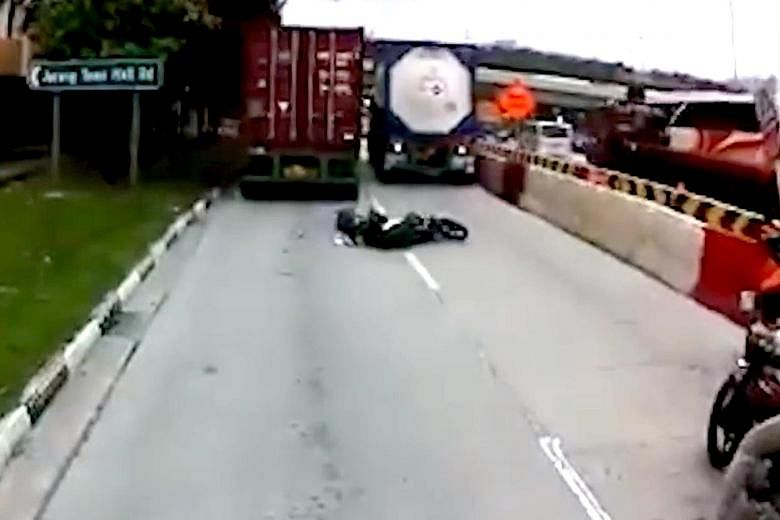 Left, from top: A dashboard video of Thursday's accident along Jalan Buroh shows the motorcyclist trying to squeeze through between two trucks, then lying sprawled on the road after being run over. The rider, Malaysian Loh Fook Siong, was pronounced 
