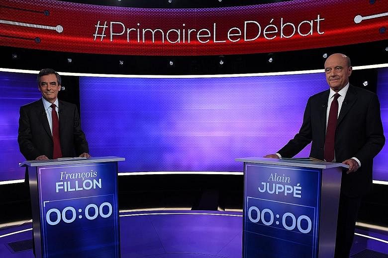Mr Fillon and Mr Juppe - the two finalists in France's conservative presidential primary - before their televised debate on Thursday. TV viewers gave victory in the debate to Mr Fillon.