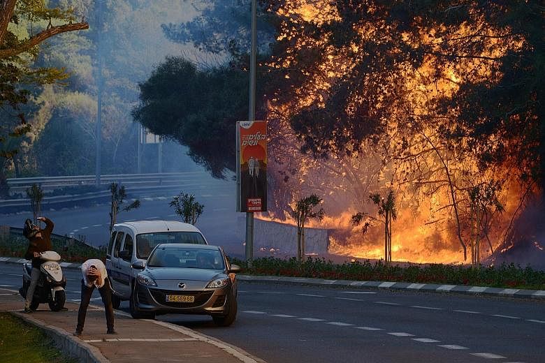 A fire on Thursday in a suburb of Haifa. Fires also raged in two areas on the outskirts of Jerusalem as well as near the Jewish settlement of Talmon in the occupied West Bank.