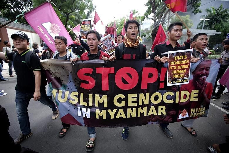 Demonstrators outside the Myanmar embassies in Kuala Lumpur (above) and Jakarta (below) calling for an end to the alleged military crackdown on the Rohingya.