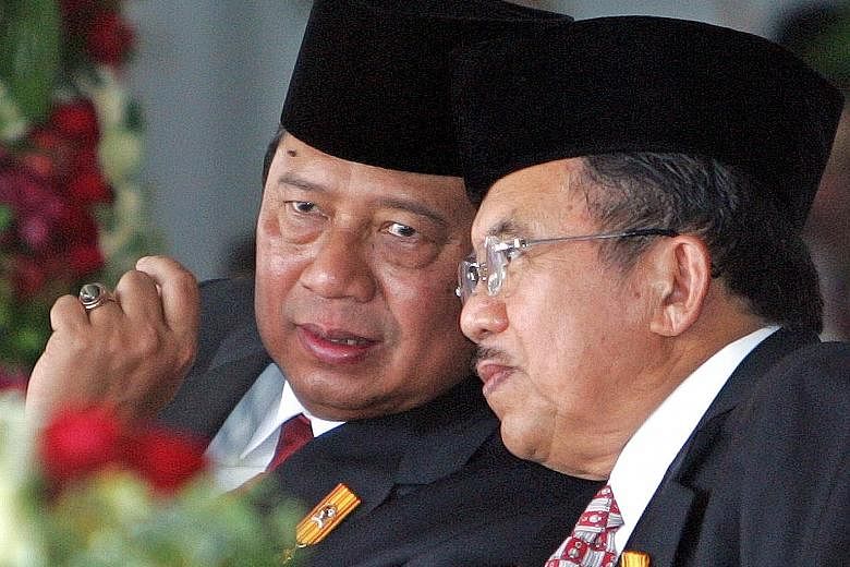 Former president Megawati Sukarnoputri (right) thought Dr Yudhoyono was far too absorbed in burnishing his own image. Dr Yudhoyono with Mr Jusuf Kalla, who was his vice-president during his first term as president. Both inevitably strayed into each o