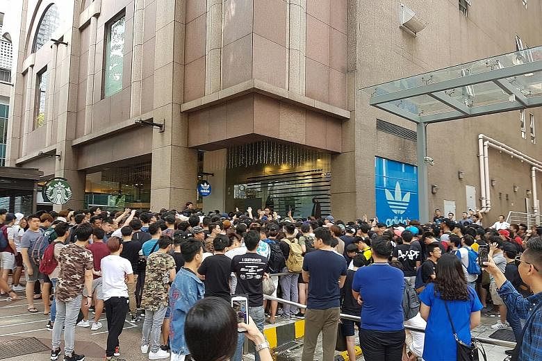 Hundreds of customers were crowded around the Adidas Originals Pacific Plaza store at about 10am yesterday. Some had been waiting outside the store for two nights since Thursday for the shoes, which cost $229.