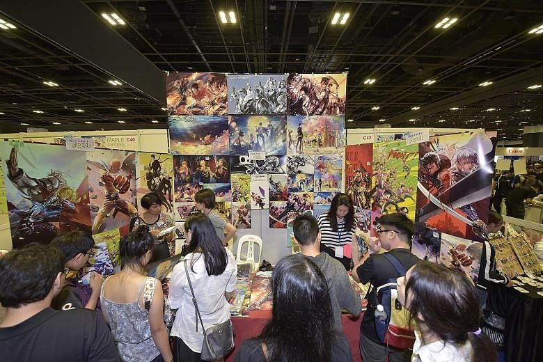 Artworks inspired by anime series, such as these by artist Zzyzzyy from Toronto, whose real name is Val Zheng, were sold at the Anime Festival Asia.